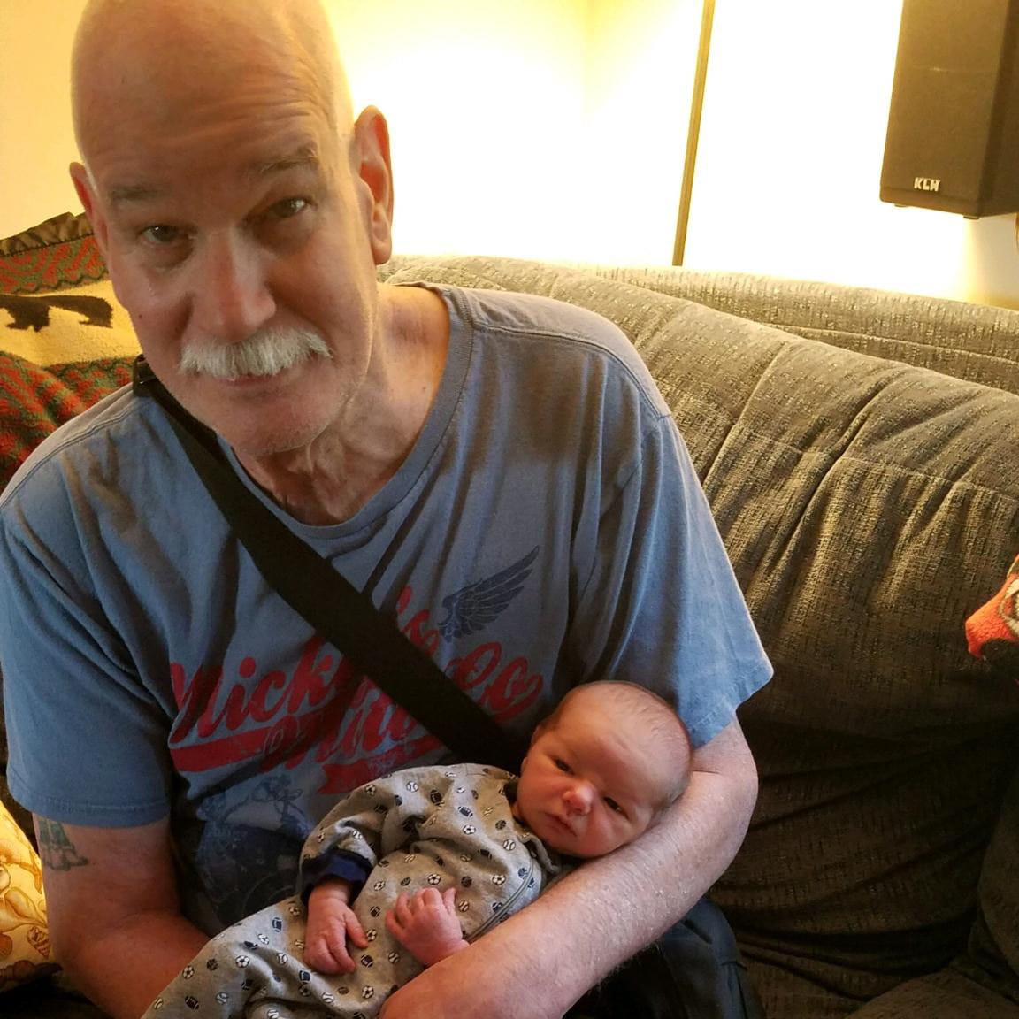 Albert Adams holding a baby